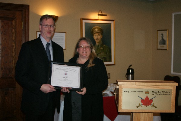 Kelly Stewart, regional vice president, presents a certificate to the chapter's January luncheon speaker, Steven Johnston, senior security and technical adviser, Office of the Privacy Commissioner of Canada.